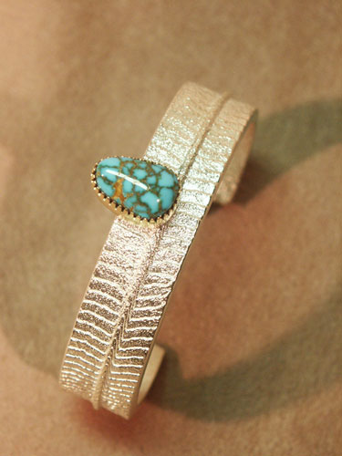 Cuttlebone Cast Sterling with Lone Mountain Turquoise bezel in 18K Gold - Bracelet